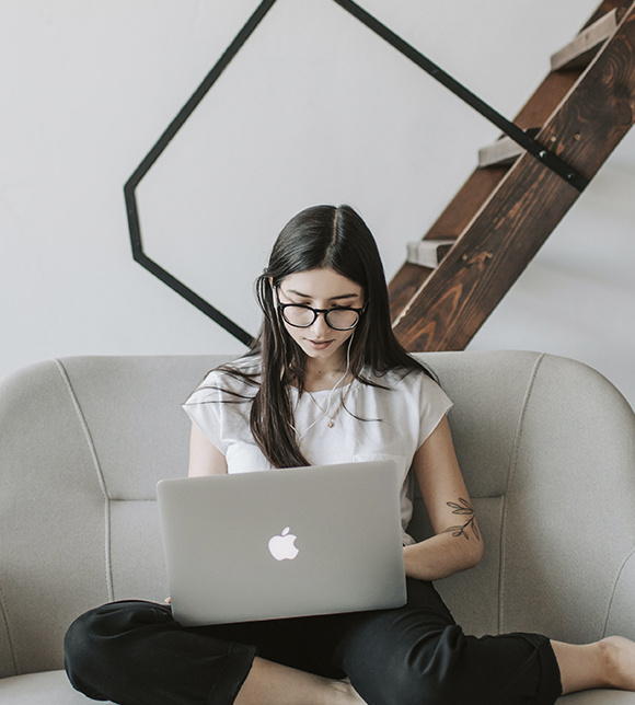 Woman on laptop surfing the internet