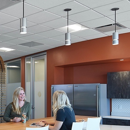 Well lit kitchen area with ceiling lighting