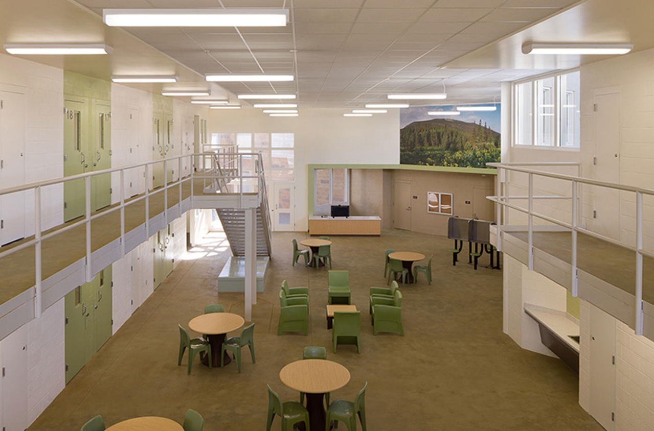 Correctional facility lighting with green chairs