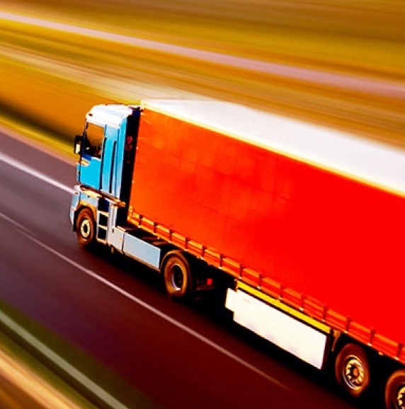 Red semi truck moving quickly 