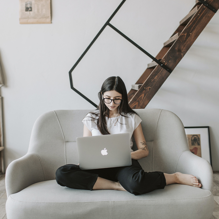 Woman on laptop surfing the internet