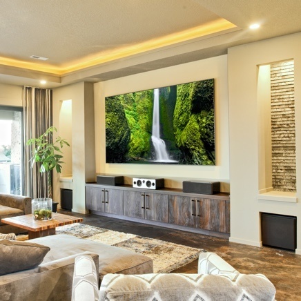 Modern tuscan home with flatscreen tv in family room