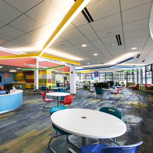 Linear suspended lights in empty library classroom
