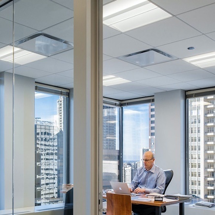 Well lit glass office, city window view