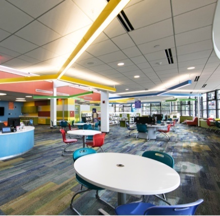 Linear suspended lights in empty library classroom