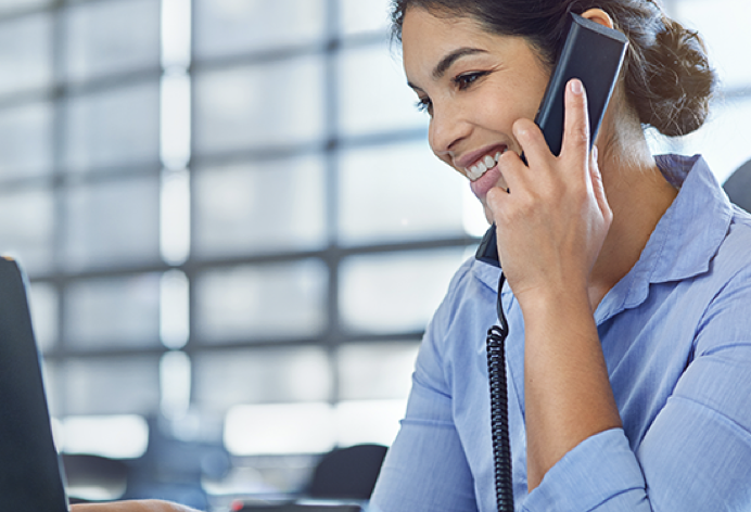 Woman on phone while speaking to customer support